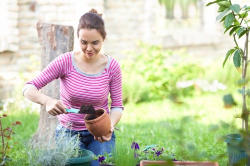 Landscape worker wearing PPE during gardening work in Barkingside